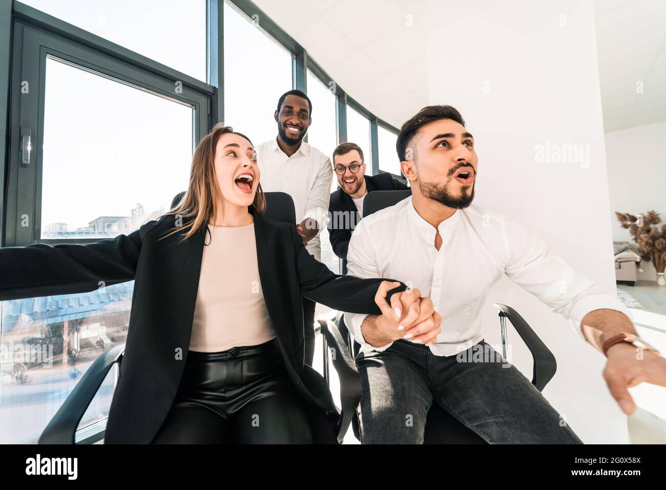 Multiracial work colleagues having fun during the break Stock Photo