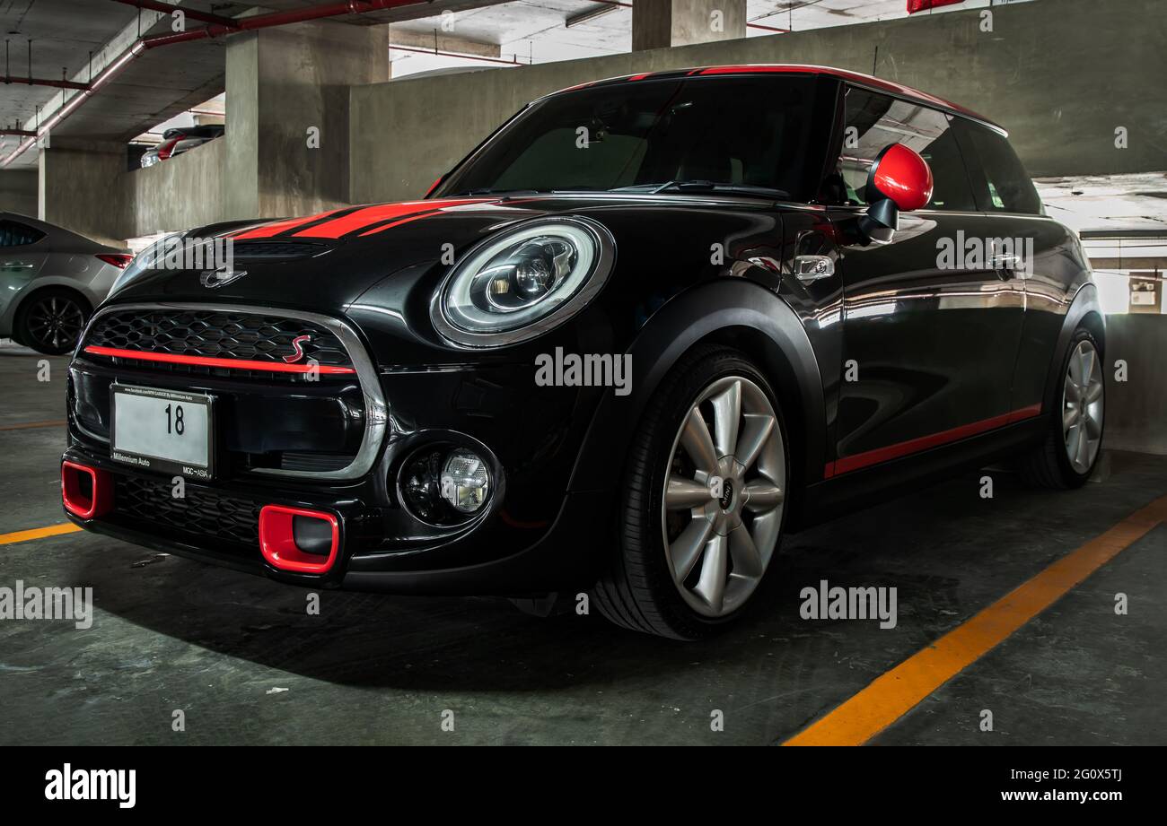 Bangkok, Thailand - 27 May 2021 : Side view of black mini cooper parked in the parking lot. Selective focus. Stock Photo