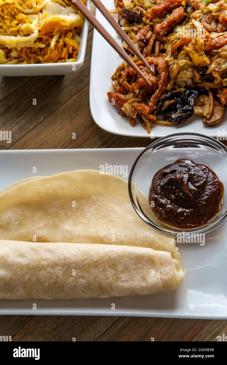 Chinese food Moo shu pork with Mandarin pancake wrappers and hoisin