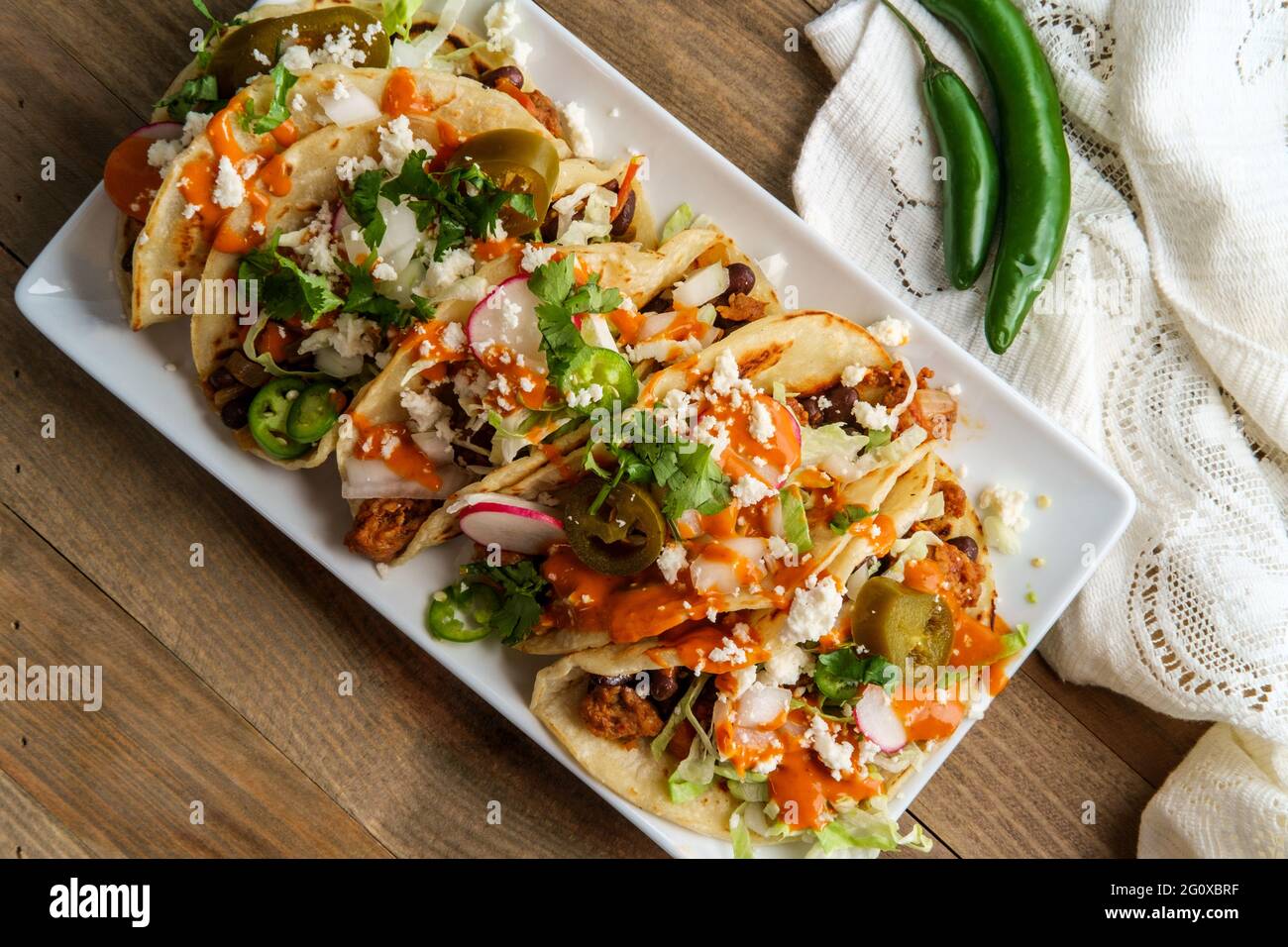 Mexican chorizo sausage black bean tacos with queso fresco jalapenos