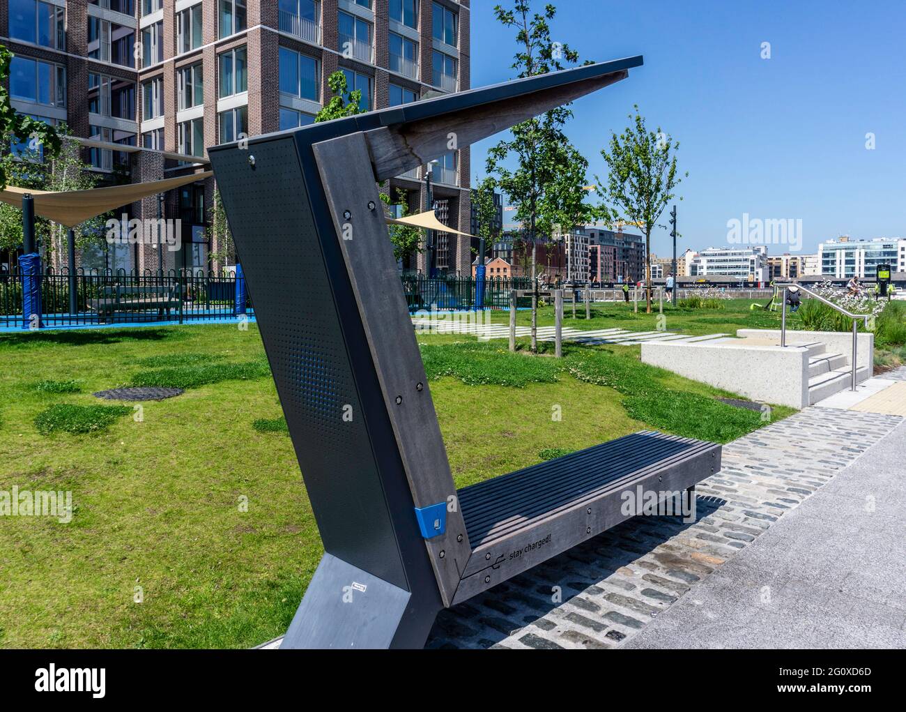 A solar powered mobile phone charger built into a public seat in