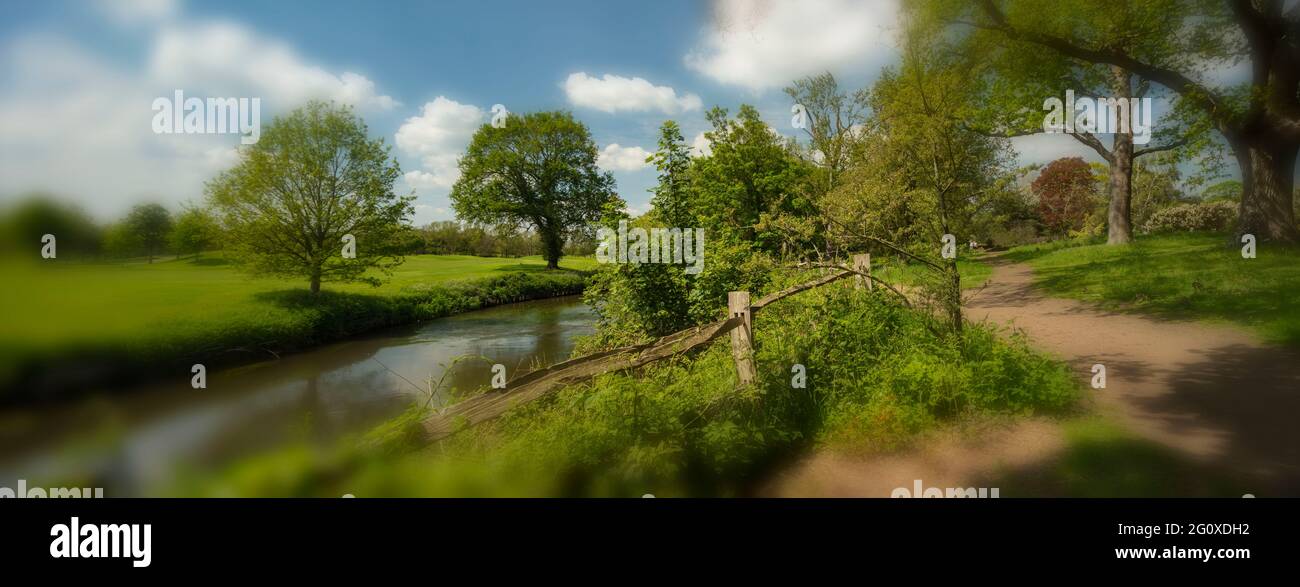 Landscape, fence, river Wey and Wisley golf course in bright Surrey spring sunshine Stock Photo