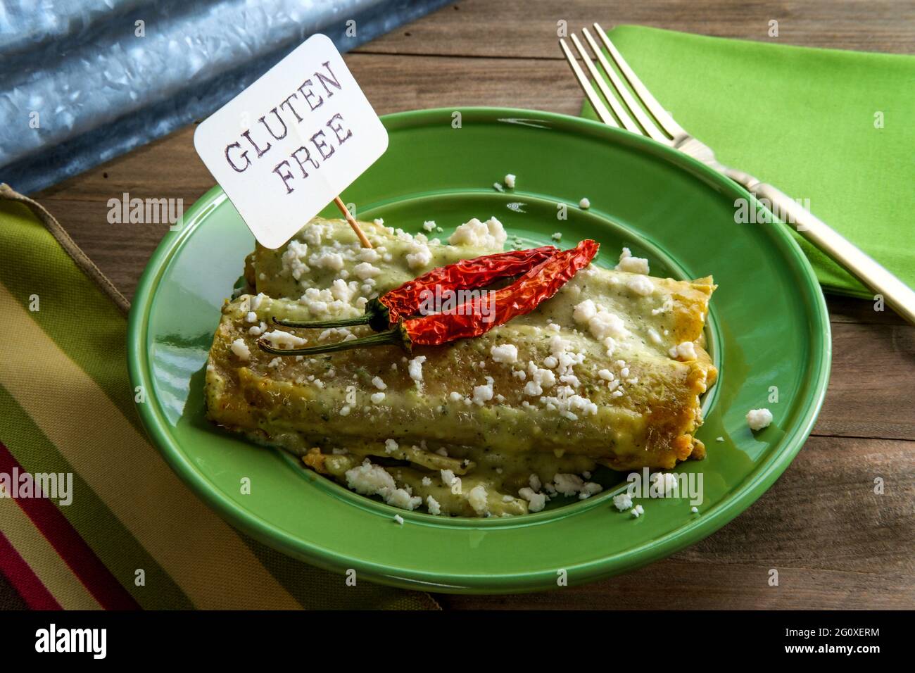 Mexican enchiladas with creamy poblano pepper sauce and queso fresco