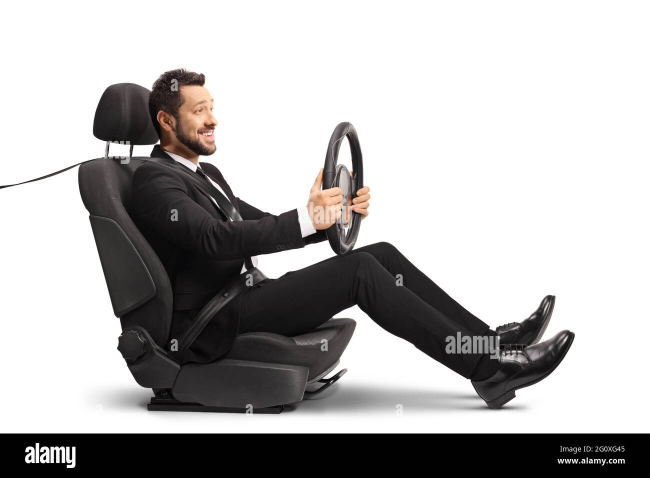 Man in a suit sitting in a car seat and driving isolated on white