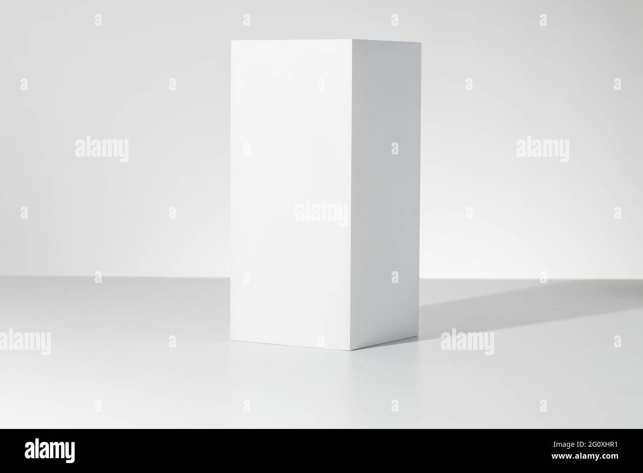 3D rendering of a white empty cube with mockup against a white ...