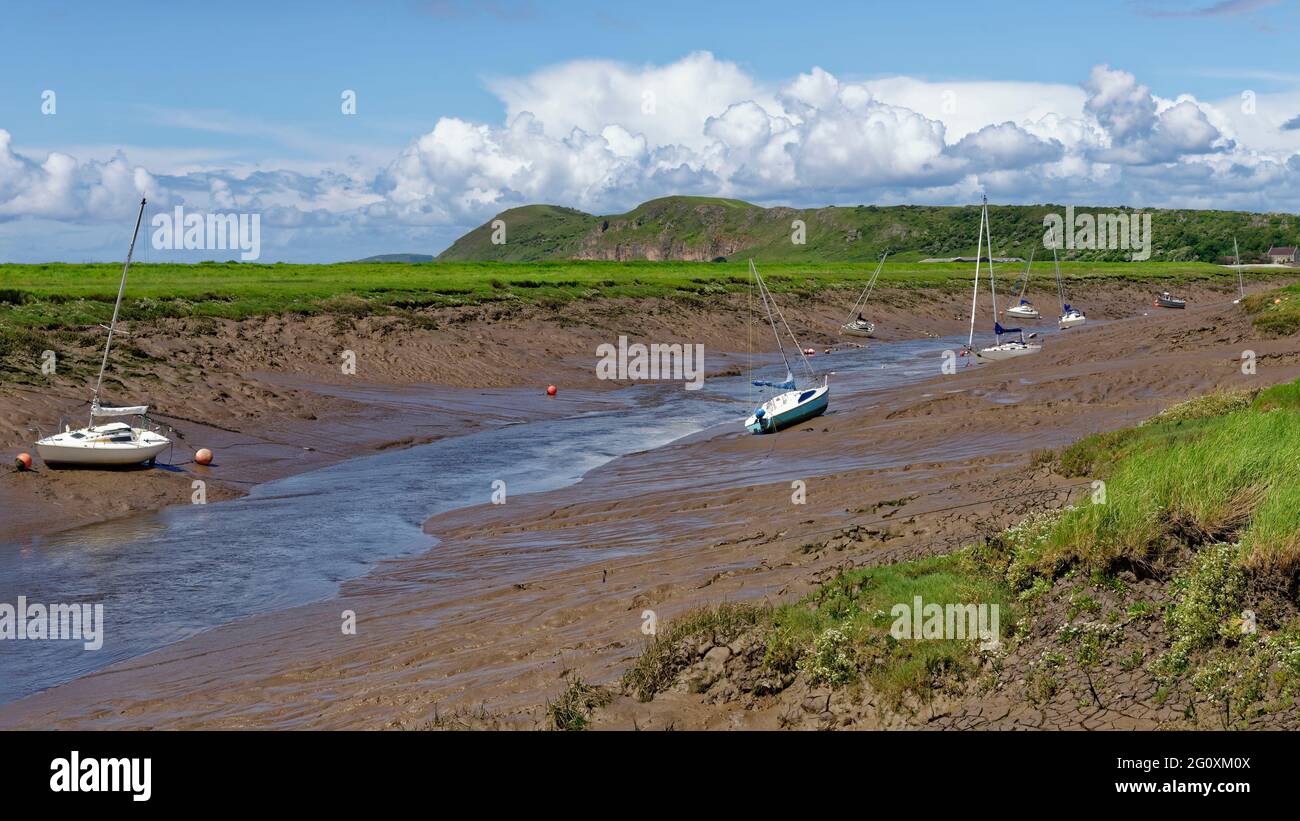 Yachts in Axe Estury at low tide, Uphill, Somerset. Brean Down in the background Stock Photo