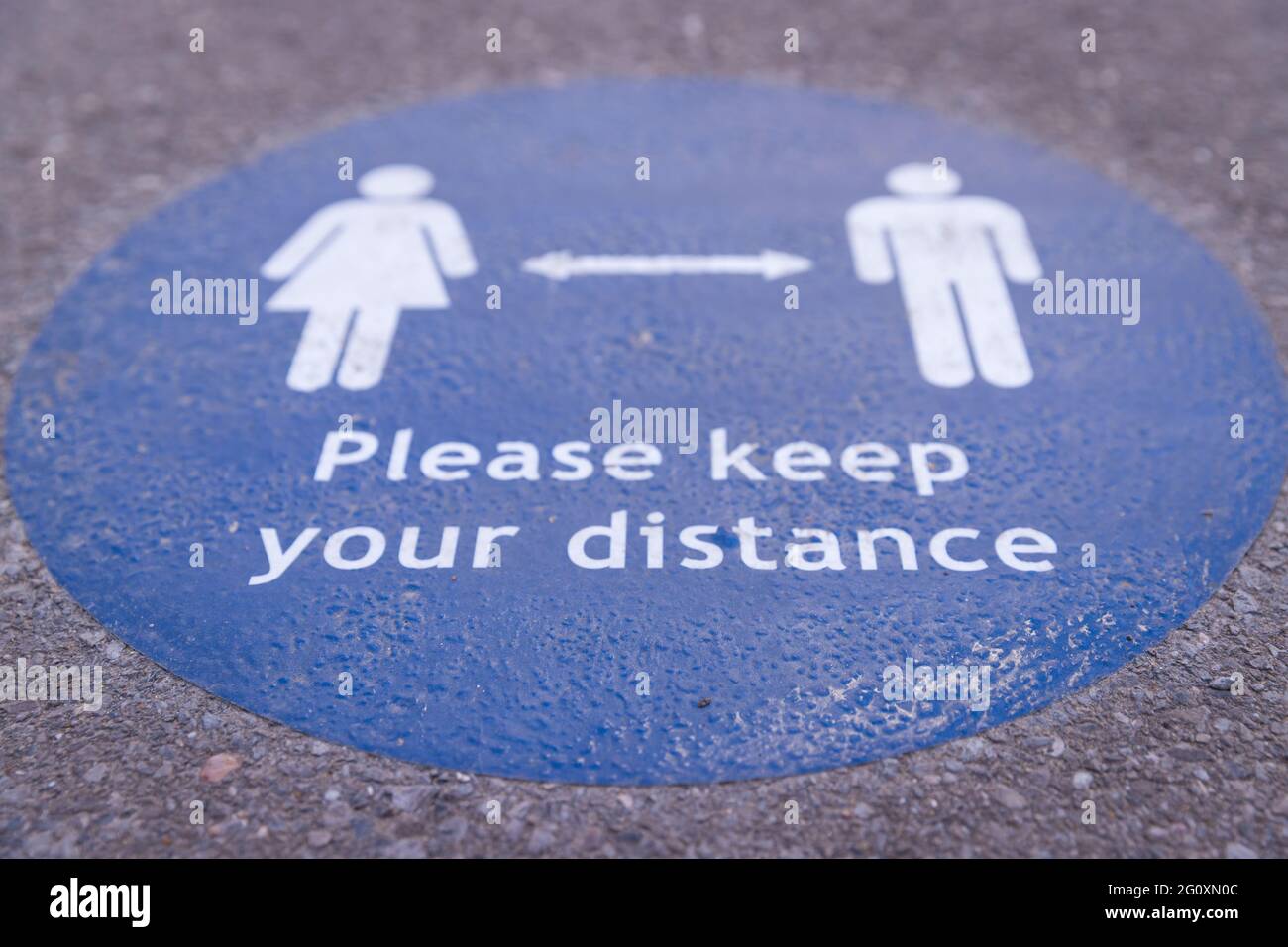 Close up of a sign inviting the public to keep their distance during the covid19 pandemic Stock Photo