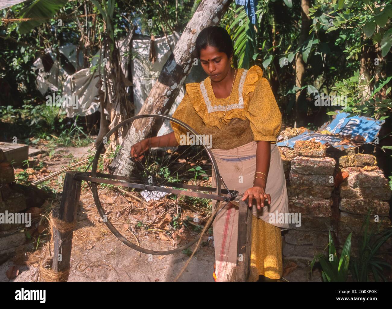 ALLEPPEY, KERALA, INDIA - Woman spinning coir, coconut fiber, into ...