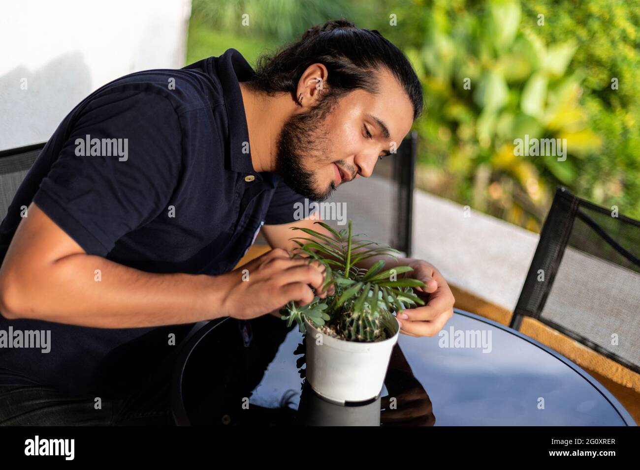 Hispanic male gardening hi-res stock photography and images - Alamy
