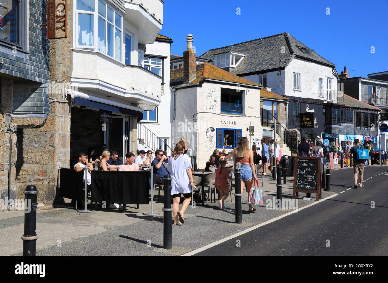 Restaurants on the harbourside in pretty St Ives, in Cornwall, SW