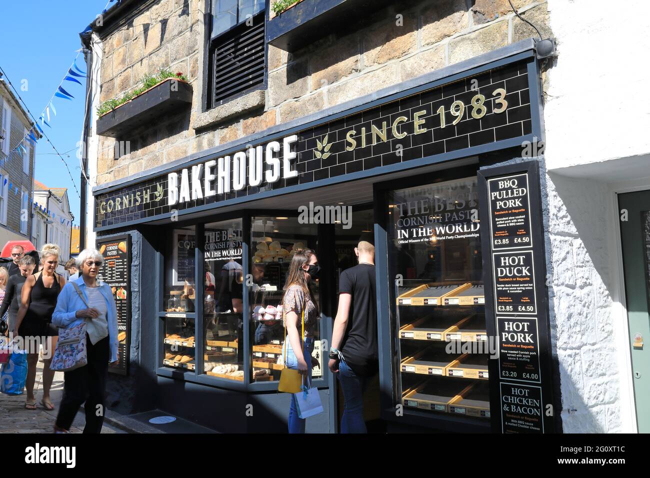 Popular Cornish pasty shop, the Bakehouse, on Fore Street, in St Ives, Cornwall, UK Stock Photo