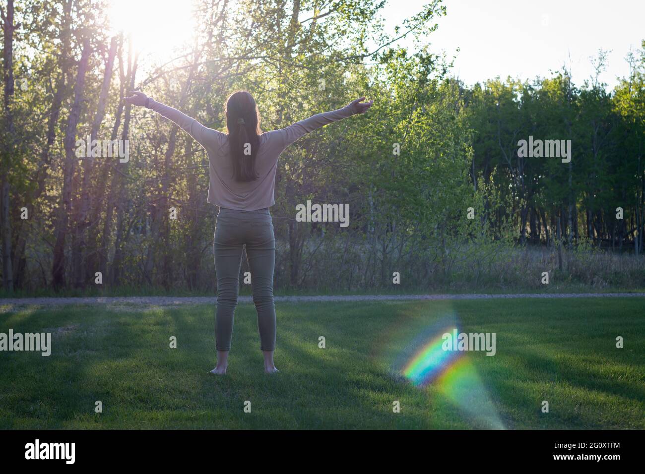 Woman arms outstretched sun hi-res stock photography and images - Alamy