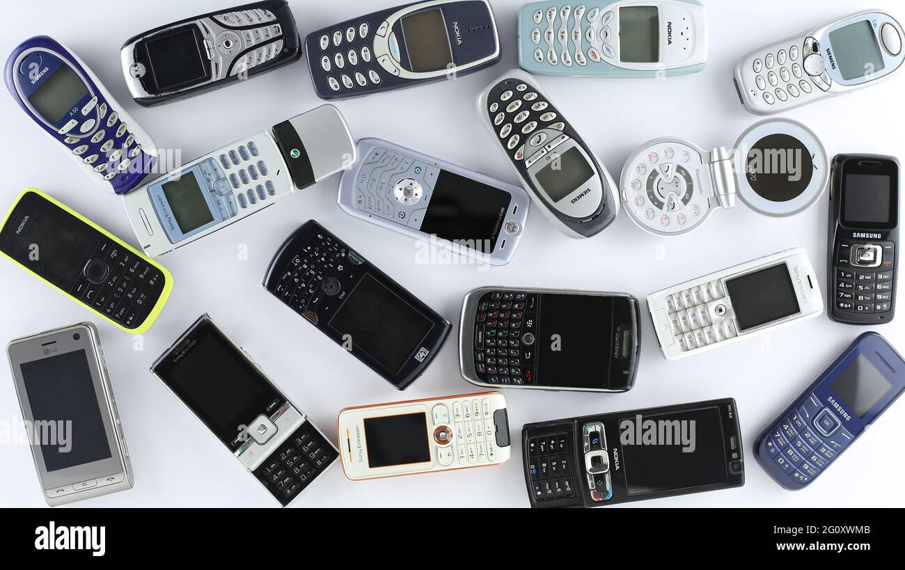 Prague, CZ- 21 January 2021:  Heap of Various brand old mobile phones. various types and generations. various types and generations of gadgets. Editor Stock Photo