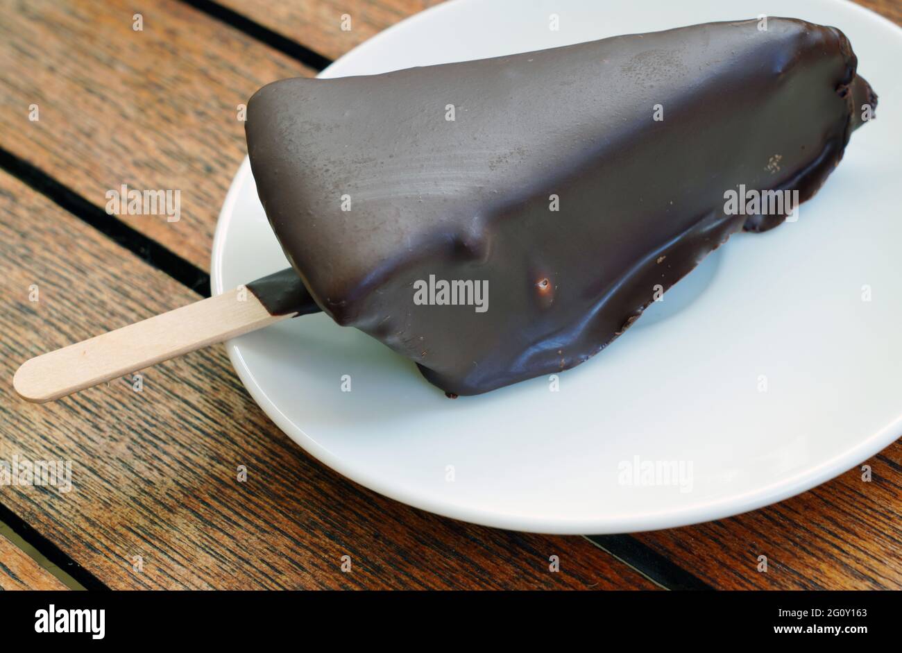 A slice of frozen key lime pie covered with chocolate on a stick Stock Photo Alamy