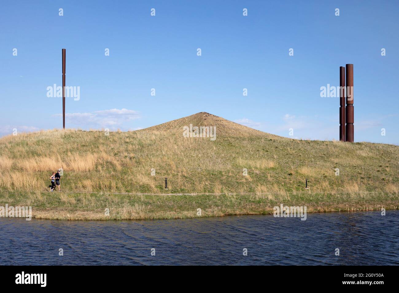 Hawk Hill Calgary Sentinels, public artwork with monoliths and pyramids by Beverly Pepper, overlooking a wetland constructed for water treatment. Stock Photo