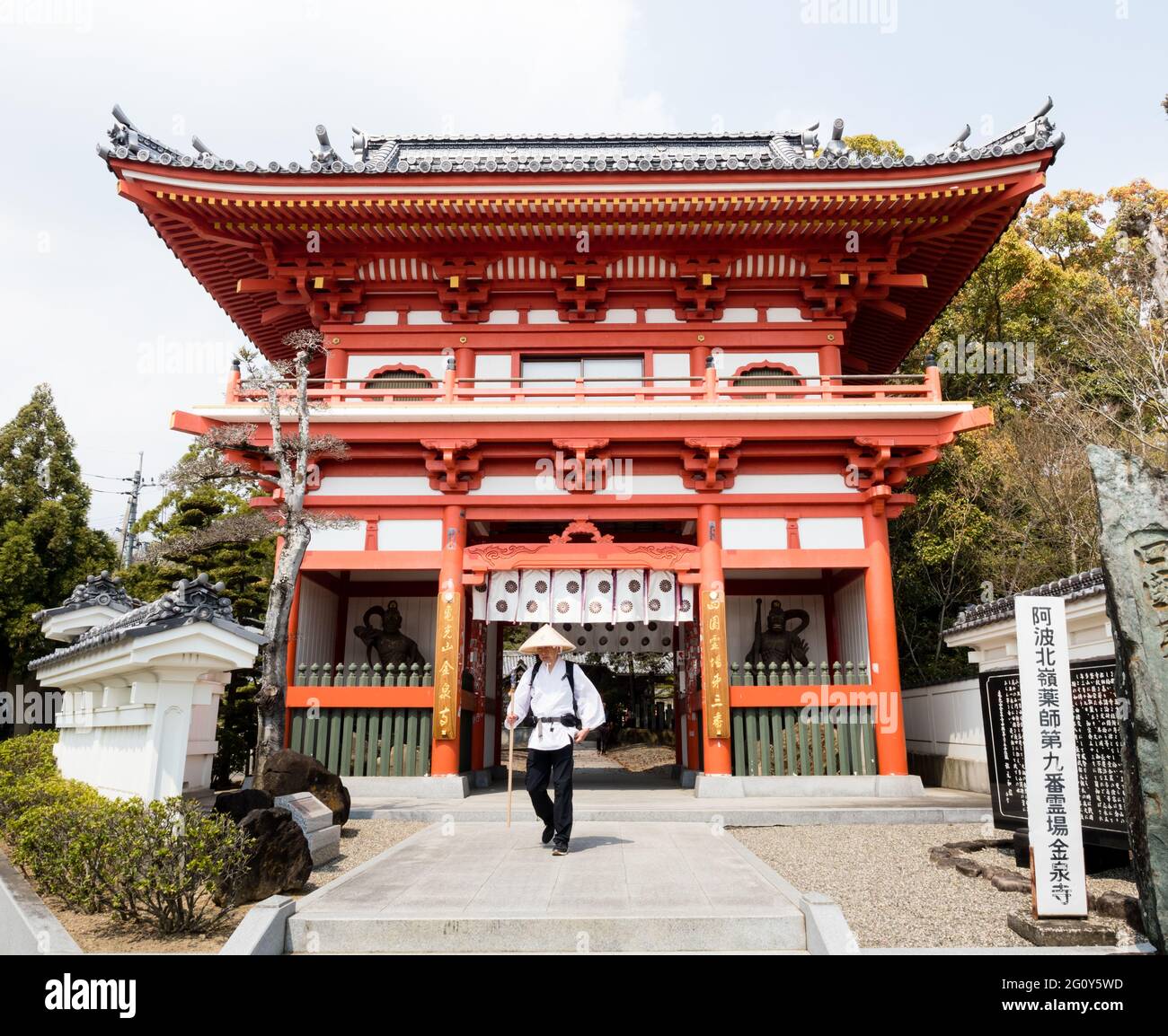 Naruto, Japan - April 2, 2018: Pilgrim at the entrance to Gokurakuji, temple number 2 of Shikoku pilgrimage Stock Photo