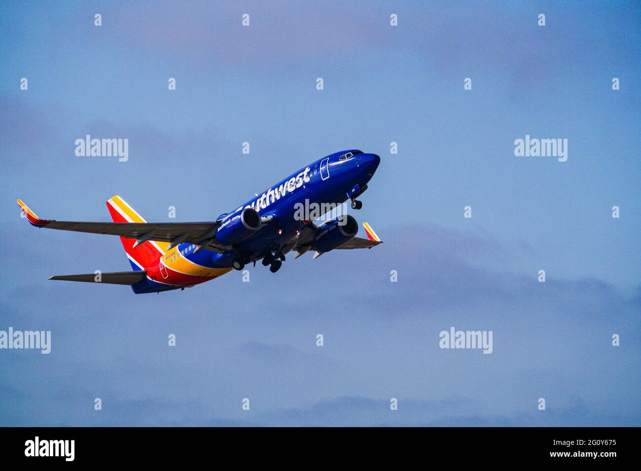 A Southwest Boeing 737 roars through the sky as it lifts off from San Jose Airport. Stock Photo