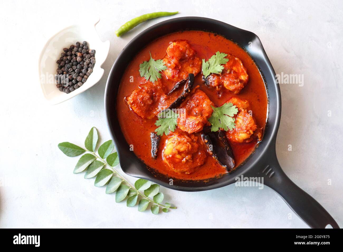Goa Food-Indian Traditional Goan Prawns or Shrimp curry. Kolambiche kalwan/Tikhle. Hot and spicy homemade fish gravy cooked using coconut milk. Stock Photo
