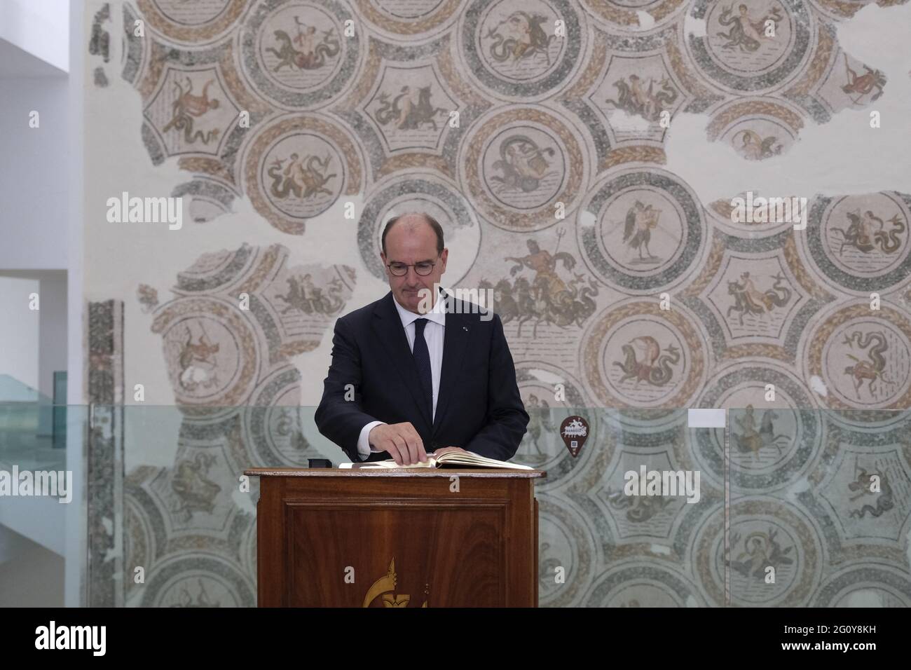 French Prime Minister Jean Castex signs the guest book at the Bardo ...