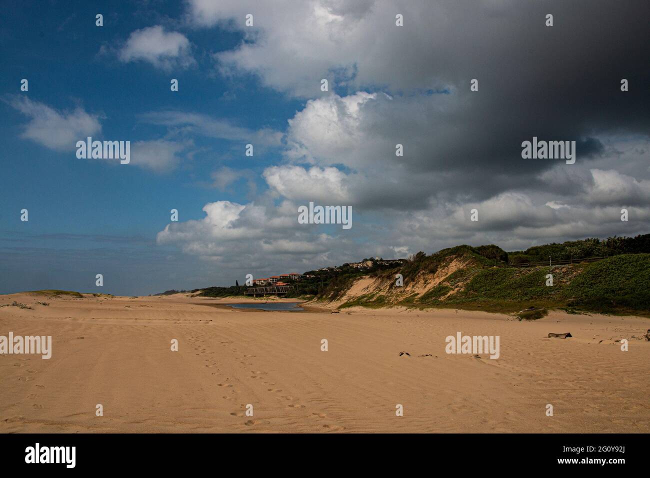 Stretch of beach with river mouth in the distance Stock Photo - Alamy