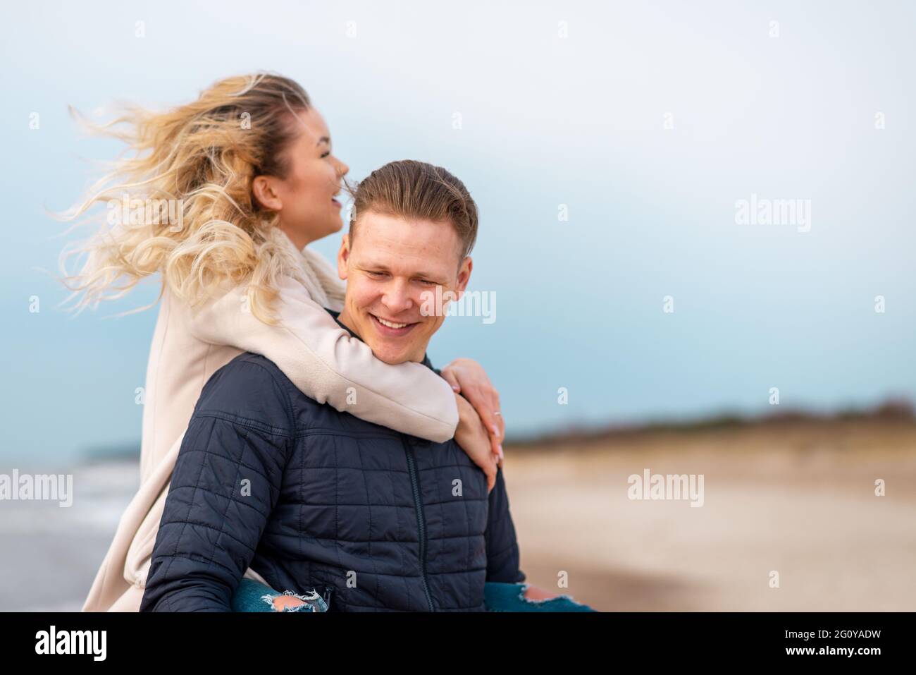 Man Giving Young Woman Piggyback Ride Smiling Side View High-Res Stock  Photo - Getty Images