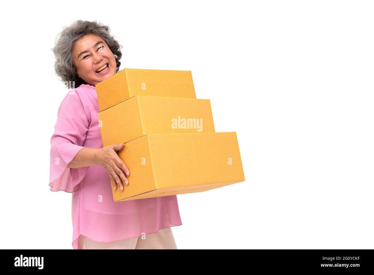 Happy Asian senior woman holding package parcel box isolated on white ...