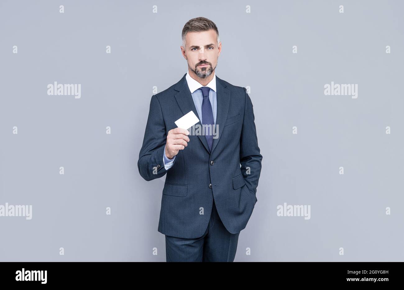 businessman demonstrating credit or debit card. empty plastic business name card. Stock Photo