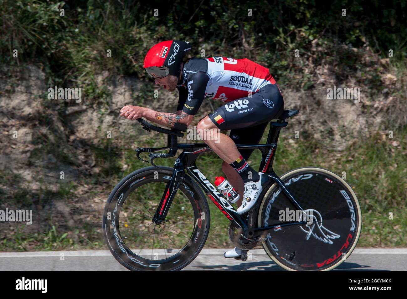 Tomasz Marczynski (Lotto - Soudal team), seen in action during an individual time trial.The Tour of Catalonia Cycling 2021 took place from March 22 to March 28, 2021. The second stage on March 23, 2021 is a time trial of 18.5 kilometers in the town of Banyoles (Spain). The winner of this stage is the Australian Rohan Dennis (Team Ineos Grenadiers). The winner of the final general classification is the British Adam Yates (Team Ineos Grenadier) Stock Photo