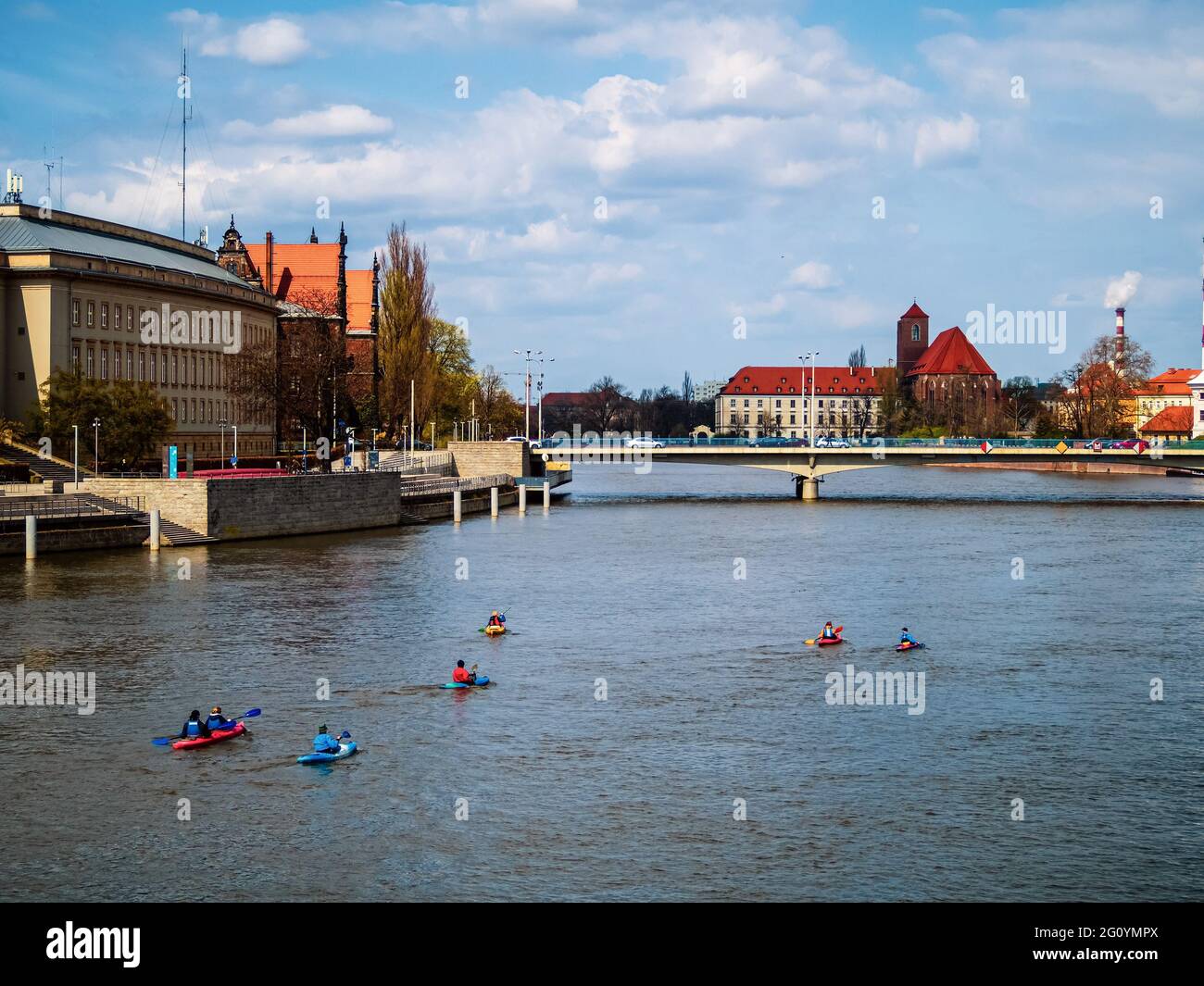 People on kayaks sailing by the river in a city. Wroclaw, Poland. City entertainment,  day off activity Stock Photo