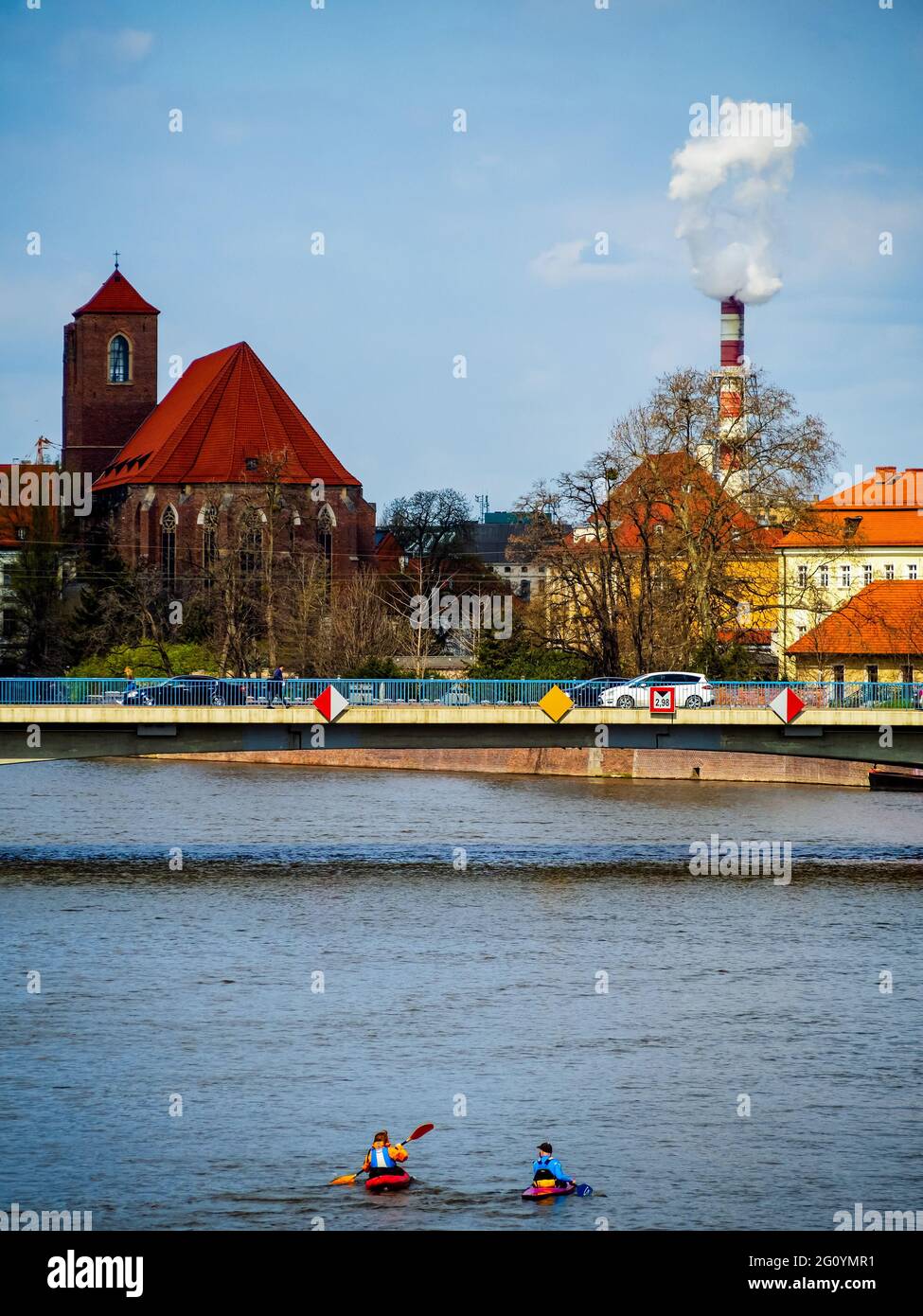People on kayaks sailing by the river in a city. Wroclaw, Poland. City entertainment,  day off activity Stock Photo