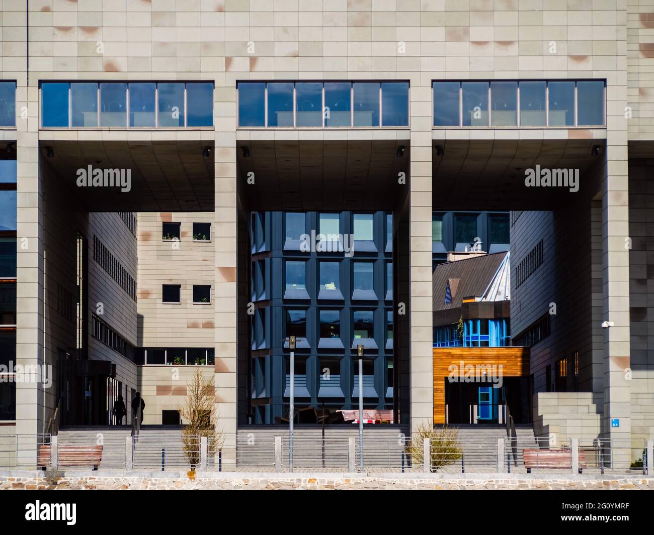 Modern city architecture, office buildings and gathering place, front view. Detail view of modern city architecture with interesting patterns and shap Stock Photo