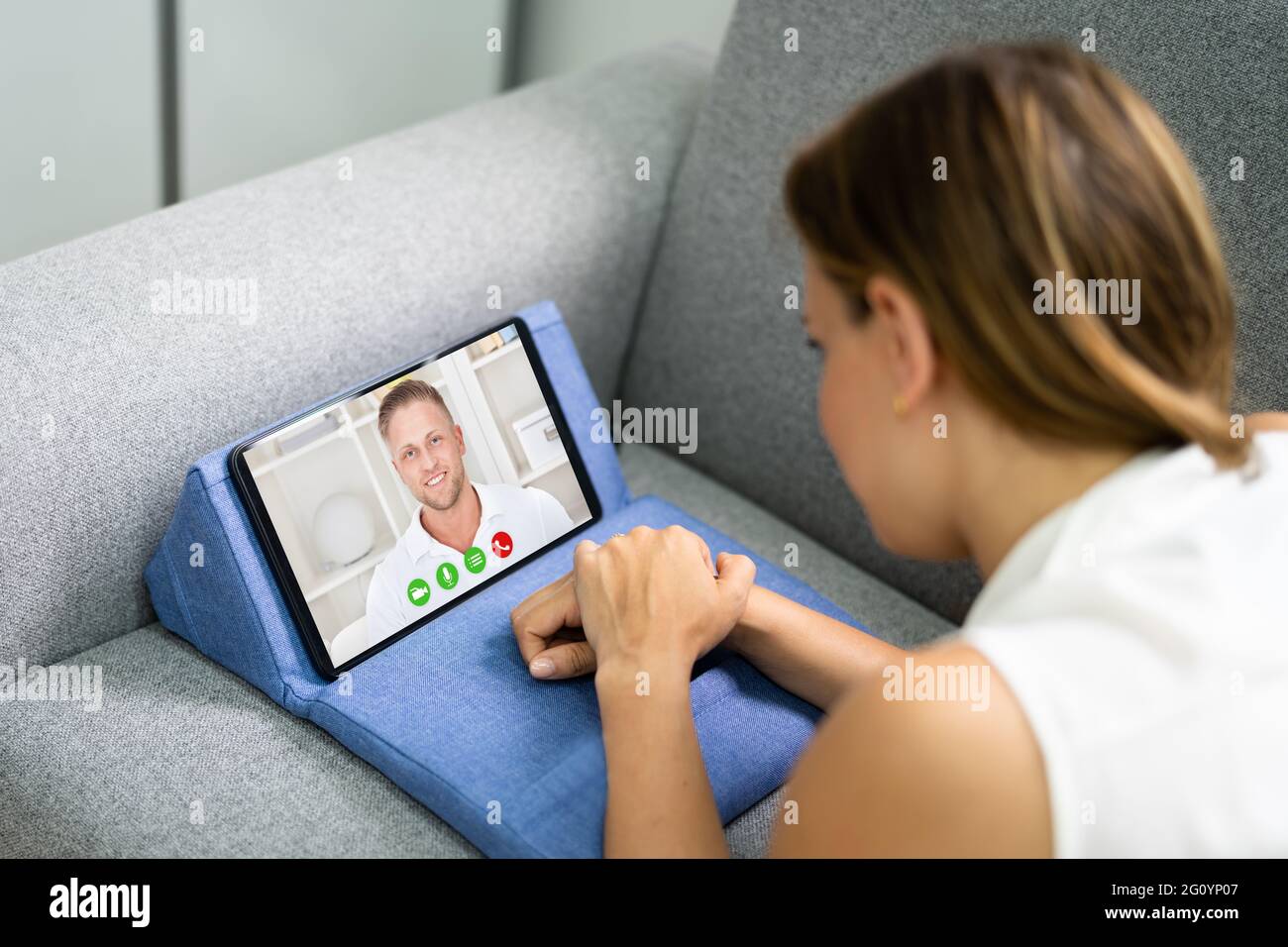 Woman Video Chat On Tablet Using Webcam Stock Photo