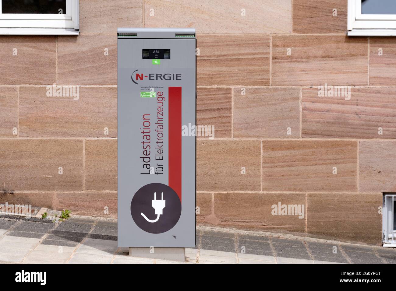 Nuremberg, Germany - May 21, 2021: A Ladestation für Elektrofahrzeuge (charging station for electric cars ) standing in the city  on a pavement in fro Stock Photo