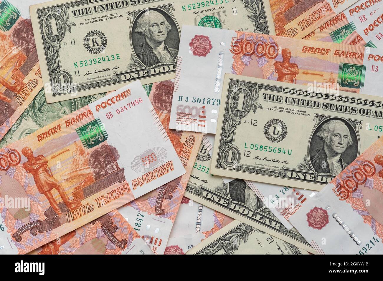 One Dollar And Five Thousand Rubles Cash Banknotes Business Concept one-dollar-and-five-thousand-rubles-cash-banknotes-business-concept