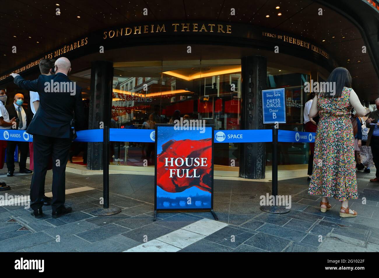 London, 3 June 2021: Sondheim Theatre in central London opens its doors to theatre goers. People due outside. Stock Photo