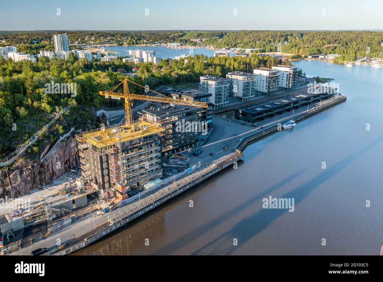 Turku, Finland - May 2021: Aerial view of construction site of residential buildings by the Aurajoki river. Stock Photo