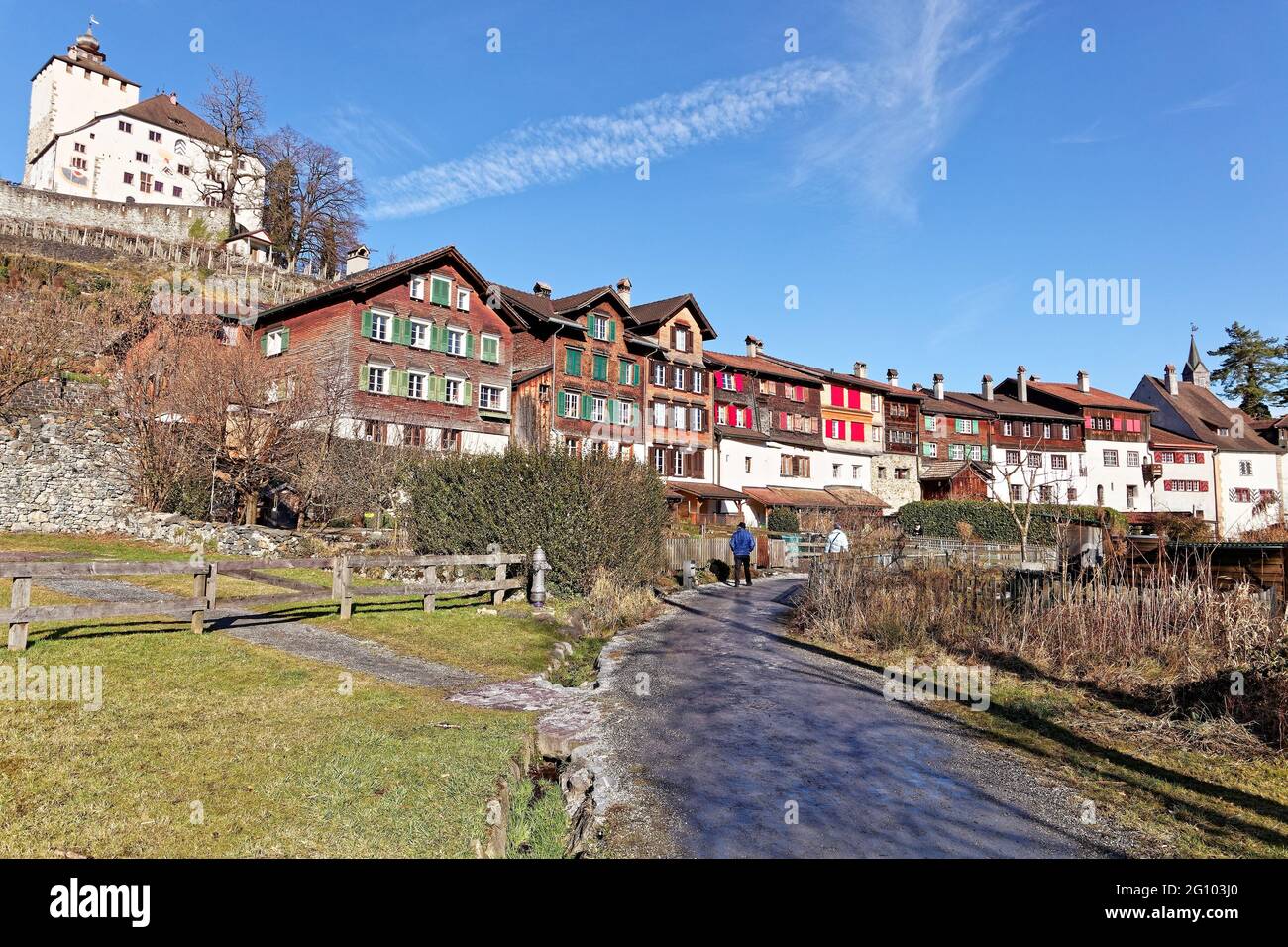 Tourists exploring historical village Werdenberg with castle and lake Stock Photo