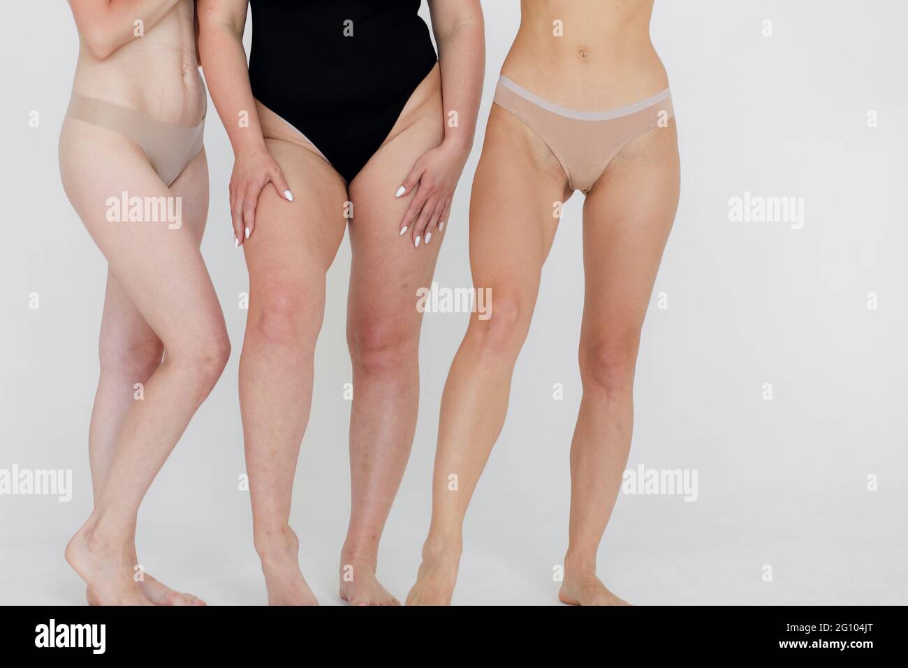 Group of women with different body and ethnicity posing together to show the woman power and strength. Curvy and skinny kind of female body concept Stock Photo