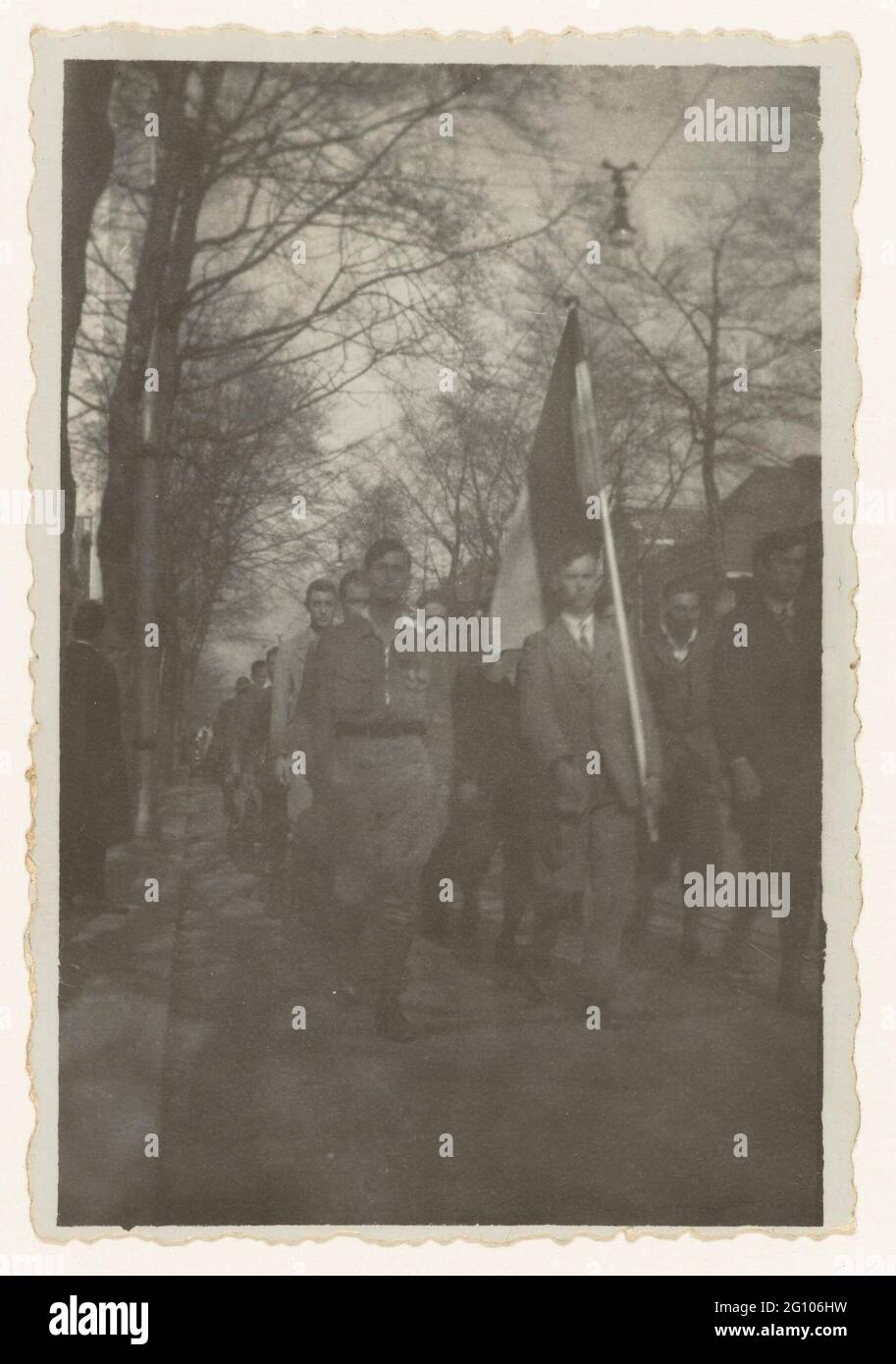 NSB parade; NSB. Procession of the NSB. In front of a man with the