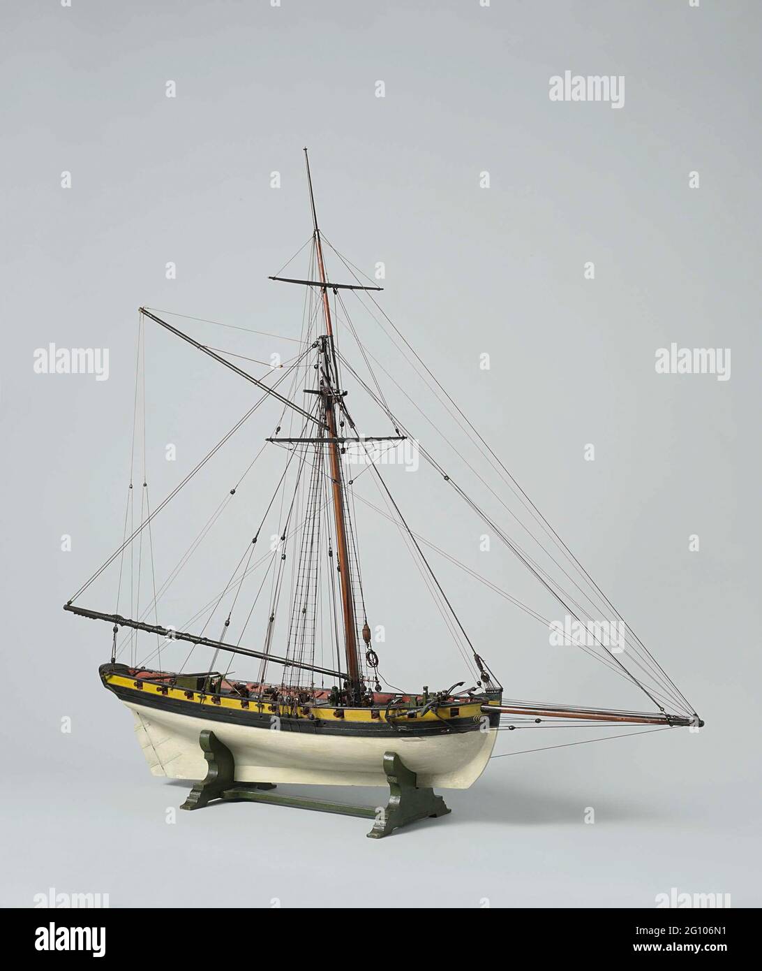 Model or A 20-gun Cutter. Polychromed, witnessed block model of a concealer of 20 pieces. It has eighteen pieces (two missing) on the open deck. The vent is bent. Flat mirror, hollow wulf polychrome painted with draperies, closed fence Polychrome painted with sitting woman with anchor by sea with ship; Straight helm with square rotation and tiller to deck, strong falling stern. The seam comes up slightly to both ends, one bark wood. The underwater ship is a sharply peaked clamp with a large steering burden. The model has two anchors, a roasting pill, two pumps and different shutters. The rig i Stock Photo
