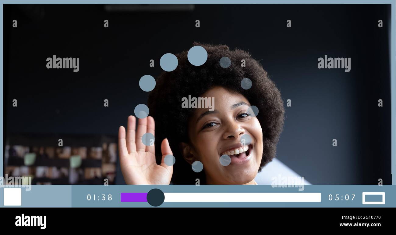 Composition of businesswoman talking on video playback interface screen Stock Photo