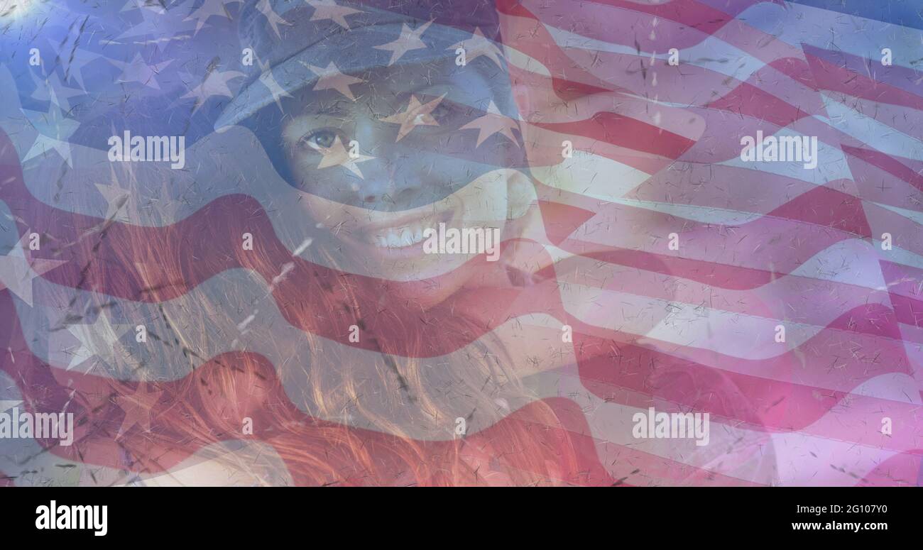 Composition of female soldier embracing daughter over american flag Stock Photo