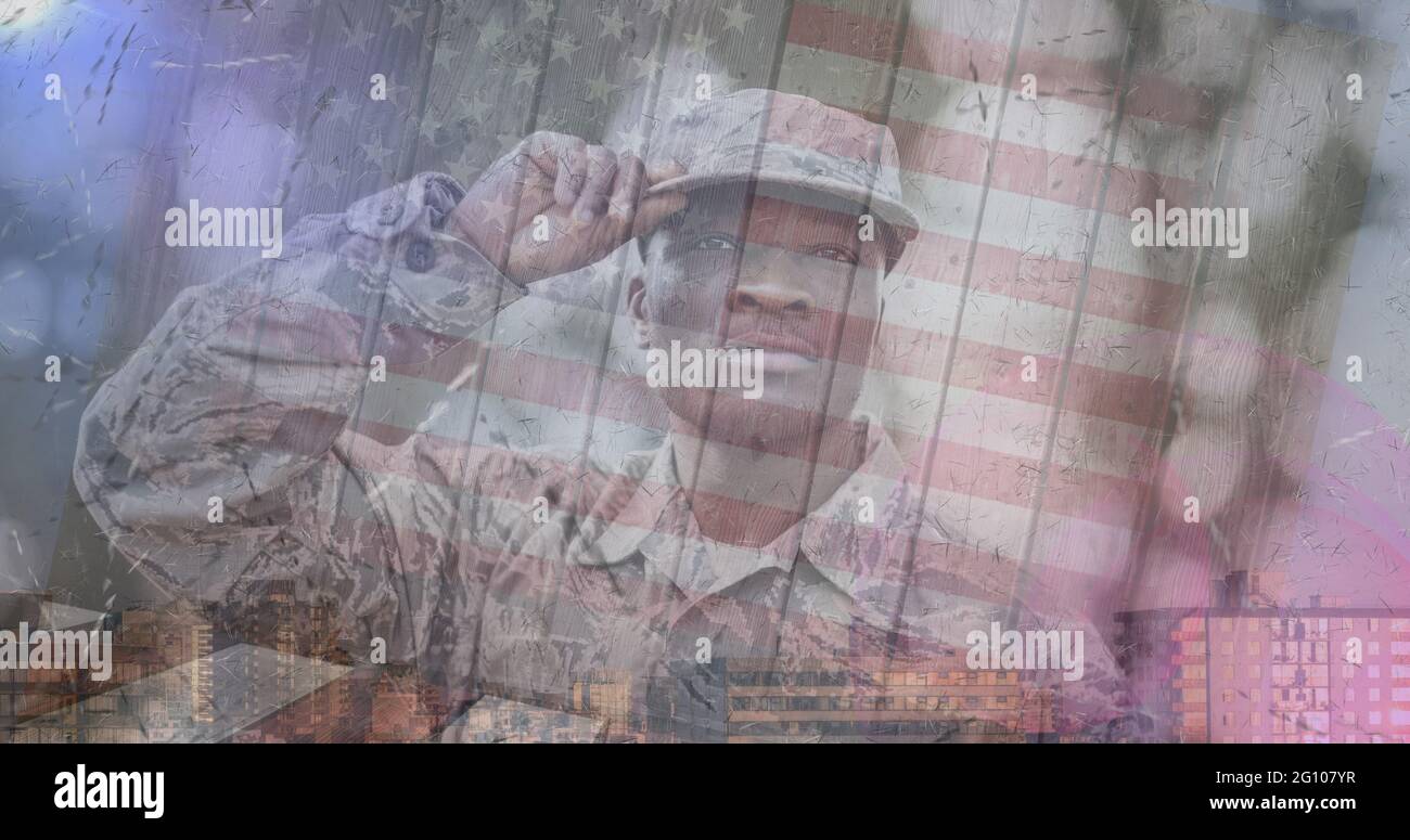 Composition of male soldier saluting over american flag Stock Photo - Alamy