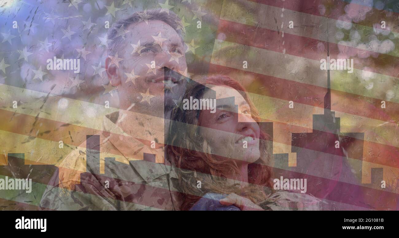 Composition of female soldier embracing smiling wife over american flag Stock Photo