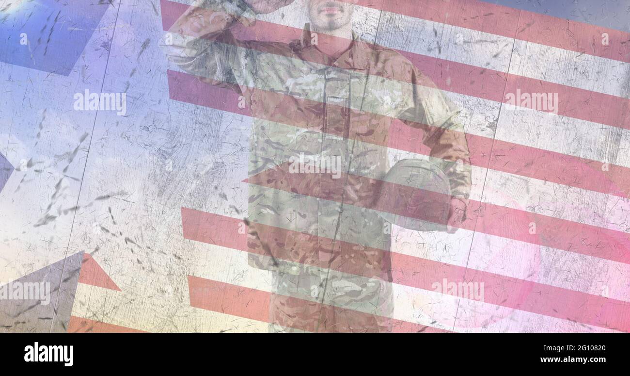 Composition of male soldier saluting over american flag Stock Photo - Alamy