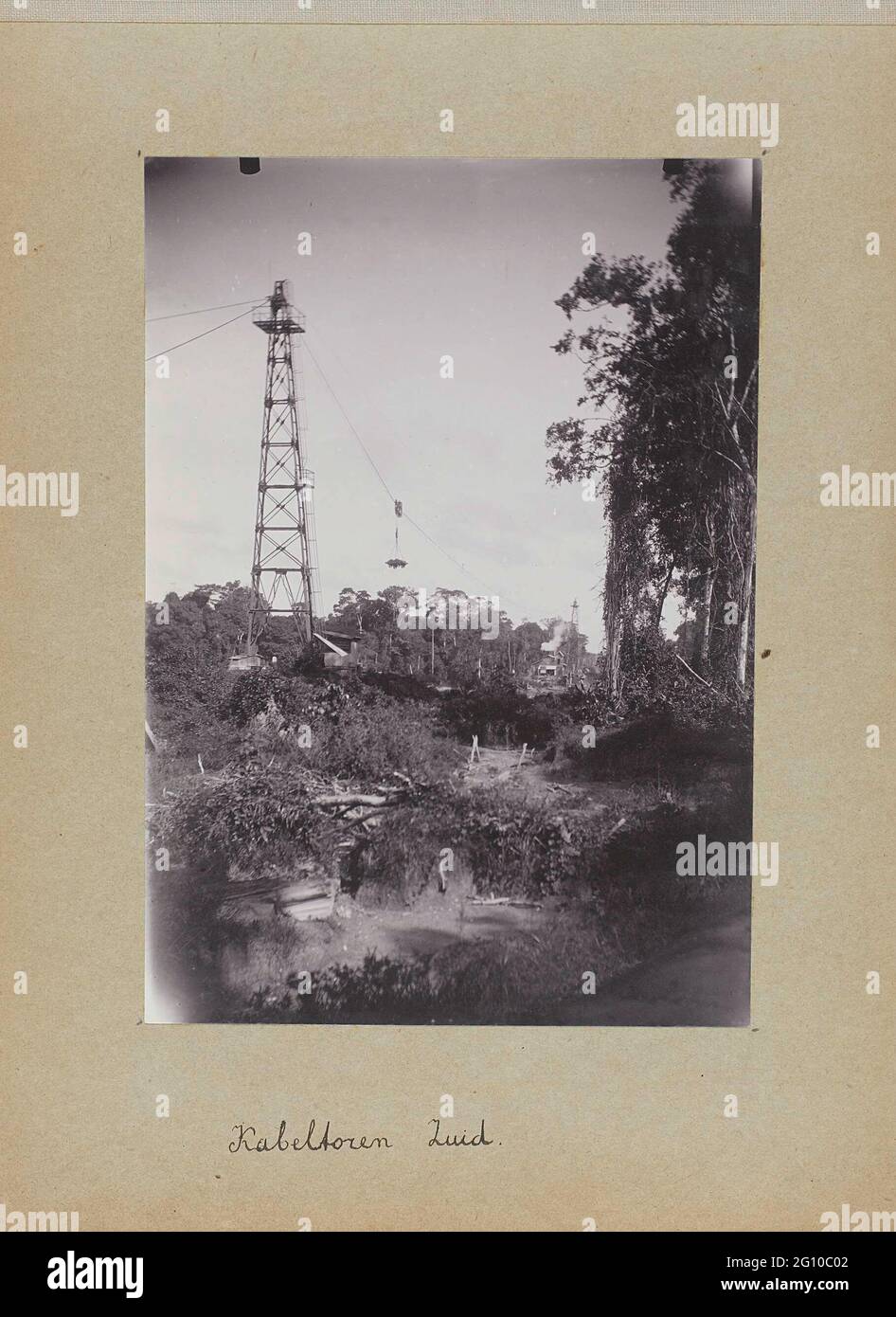 Cable tower South. The cable tower on the south side of the surinamer river. Photo in the photo album about the construction of the Lawaspoor road in Suriname in the years 1903-1912. Part of a group of objects from the Wesenhagen family in Suriname. Stock Photo