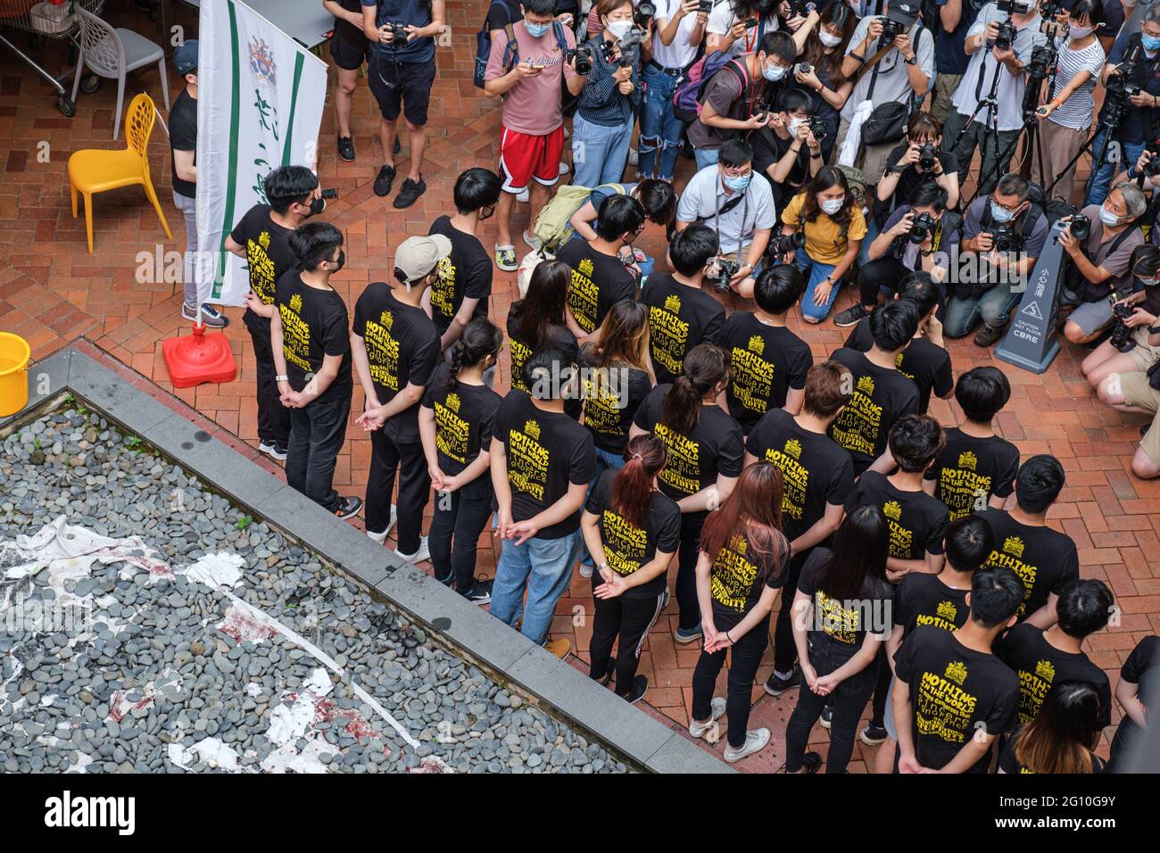 Hong Kong, China. 04th June, 2021. Members of Hong Kong University Students' Union gather to commemorate the June Fourth Incident. The annual ritual of washing the Pillar of Shame, a sculpture located on the University of Hong Kong campus that commemorates the victims of the 1989 Tiananmen Square crackdown in Beijing, was held as Hong Kong remembers June 4 for the first time since Beijing imposed a national security law on the city. Credit: SOPA Images Limited/Alamy Live News Stock Photo