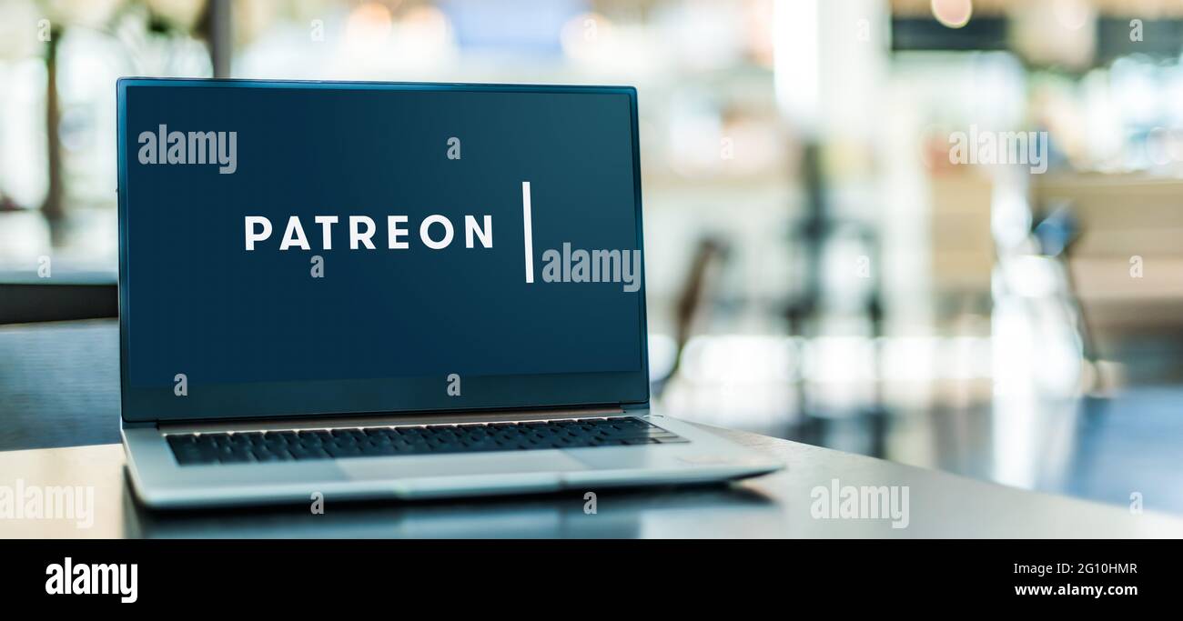 POZNAN, POL - MAY 1, 2021: Laptop computer displaying logo of Patreon, a membership platform that provides business tools for content creators to run Stock Photo