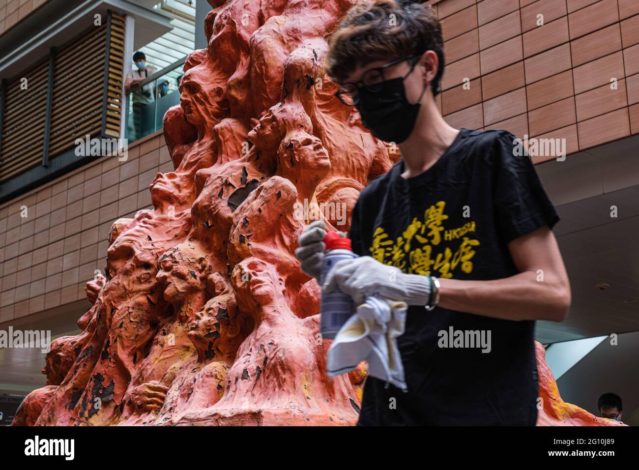Hong Kong, China. 04th June, 2021. A member of Hong Kong University Students' Union cleans the Pillar of Shame to commemorate the June Fourth Incident. The annual ritual of washing the Pillar of Shame, a sculpture located on the University of Hong Kong campus that commemorates the victims of the 1989 Tiananmen Square crackdown in Beijing, was held as Hong Kong remembers June 4 for the first time since Beijing imposed a national security law on the city. (Photo by Hsiuwen Liu/SOPA Images/Sipa USA) Credit: Sipa USA/Alamy Live News Stock Photo