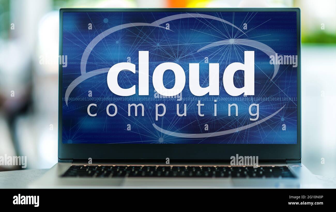 Laptop computer displaying the sign of cloud computing. Stock Photo